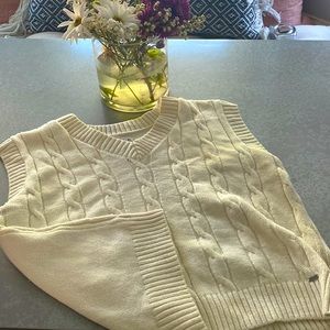 This is a sleeveless sweater vest from Holister California.